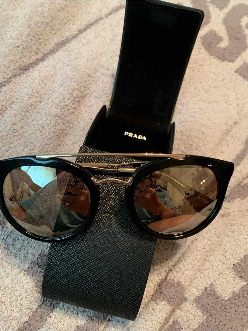 Prada Black Frame Sunglasses with Gold Bridge